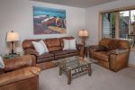 Relax after a day of recreation in the living room with comfortable oversized couch & chairs.